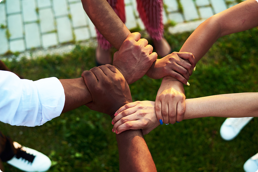 People with Hands United in Unity